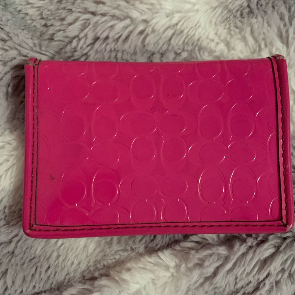 pink Coach patent leather fold wallet